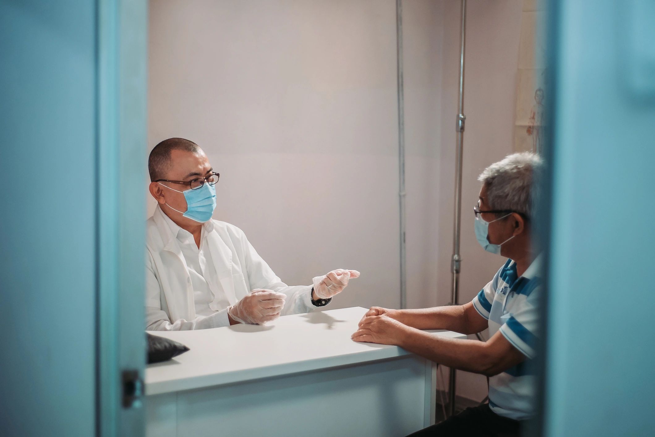 Doctor speaking with a patient in a consultation setting