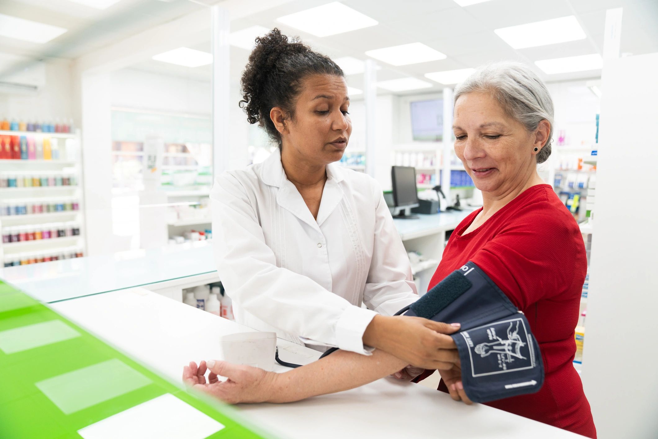 Healthcare professional assisting an older patient