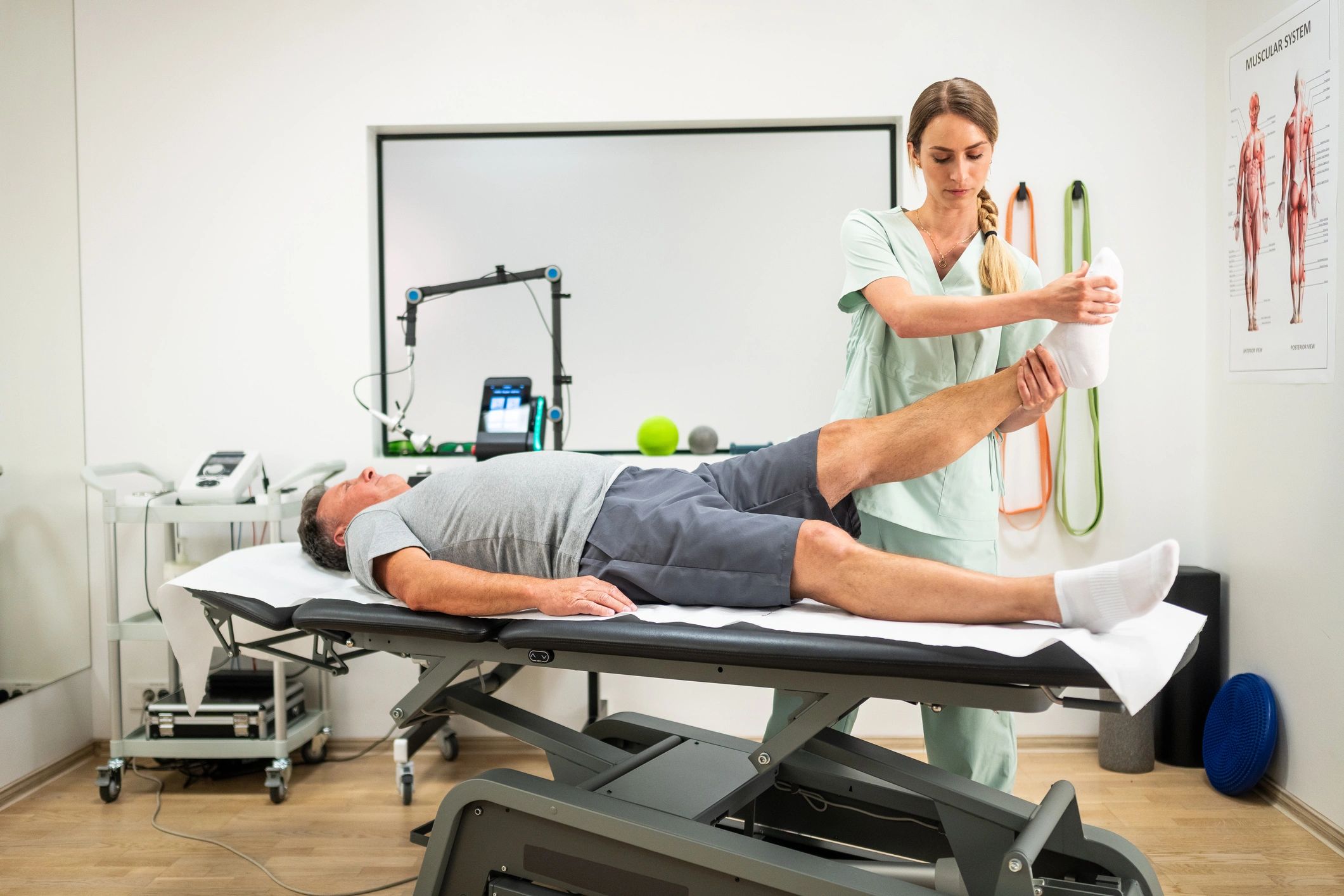 Physical therapist providing hands-on support during a rehabilitation session